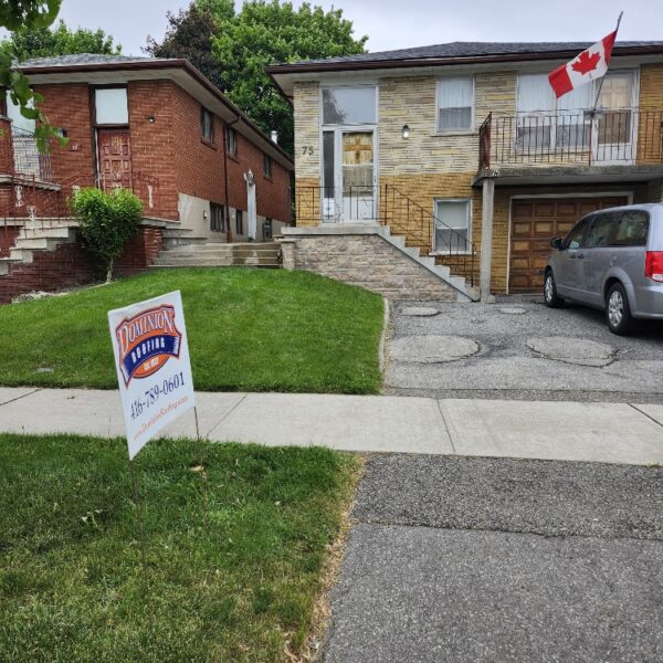 A house with a Canadian flag on the balcony, a car parked in the driveway, and a “Dominion Lending Centres” sign with a phone number on the lawn. The sky is overcast and there are trees and another house nearby. Dominion Roofing | BRAMPTON | BURLINGTON | ETOBICOKE | MARKHAM | MISSISSAUGA | NORTH YORK | OAKVILLE | RICHMOND HILL | Scarborough | TORONTO | VAUGHAN | dominionroofing.com | Phone Number: 416-789-0601